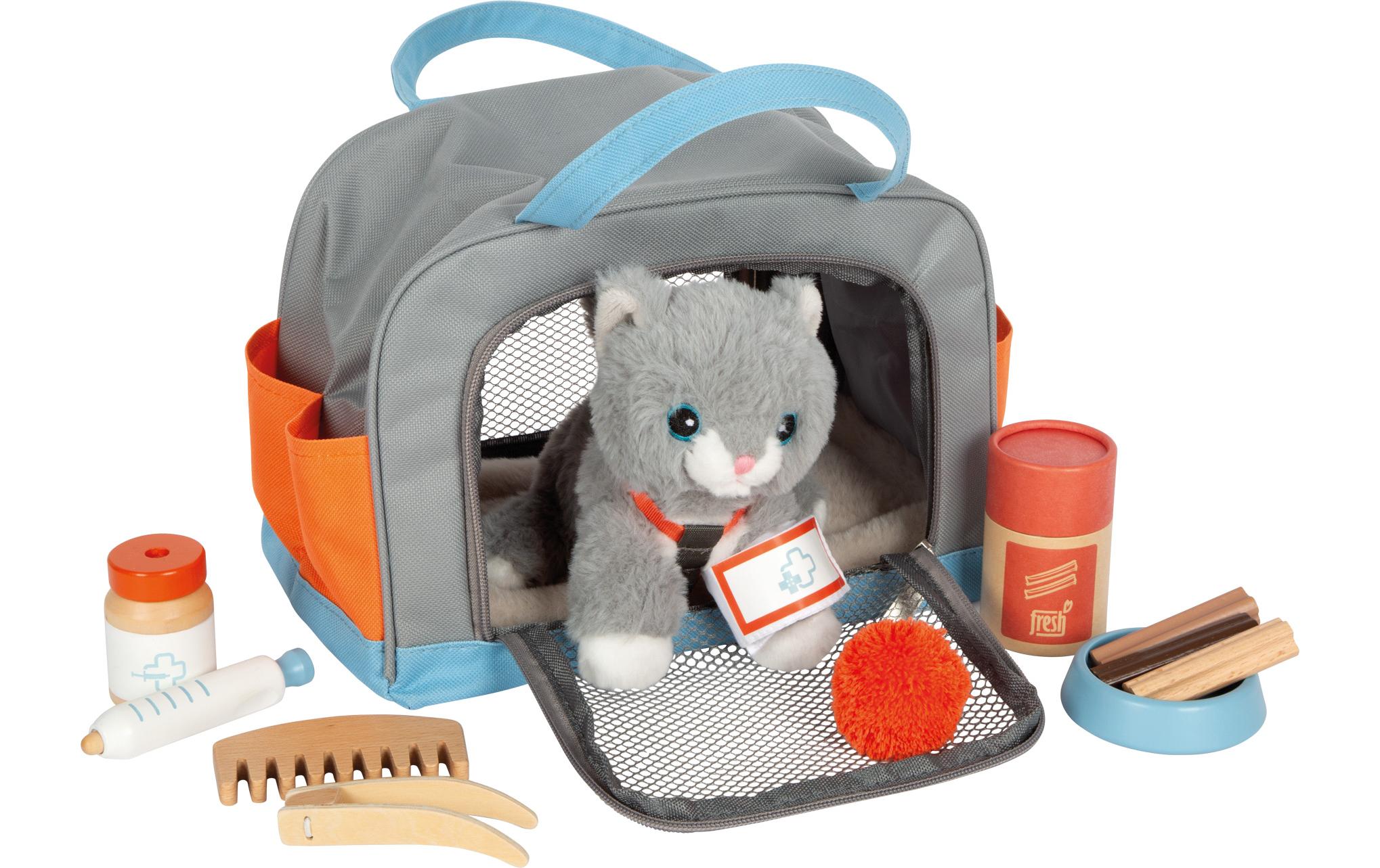 Katze mit Tasche und Pflege-Set